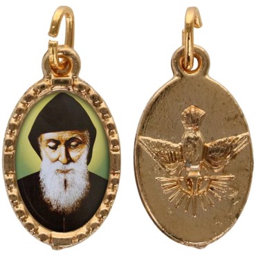 Médaille métal de couleur dorée ovale avec rebord effet dentelle H.1,5 cm avec résine. Disponible avec différents Saints