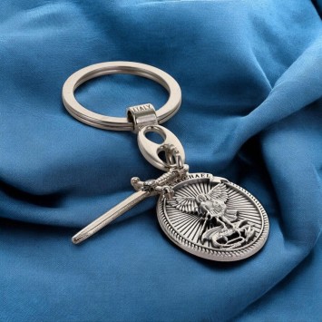 Porte-clés ovale en métal avec Saint Michel entouré de rayons, breloque épée H. 3 cm.