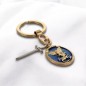 Porte-clés en métal doré, émail bleu, Saint Michel avec rayons et breloque épée – H. 3 cm.