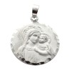Médaille en argent 925 °/°° de la Vierge à l'enfant, bord festonné Ø 1,8 cm (2,15 g). Livrée en boite