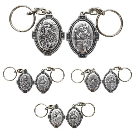 Porte-clés H. 4.5 cm en métal couleur argentée forme ovale double face, plusieurs saints.