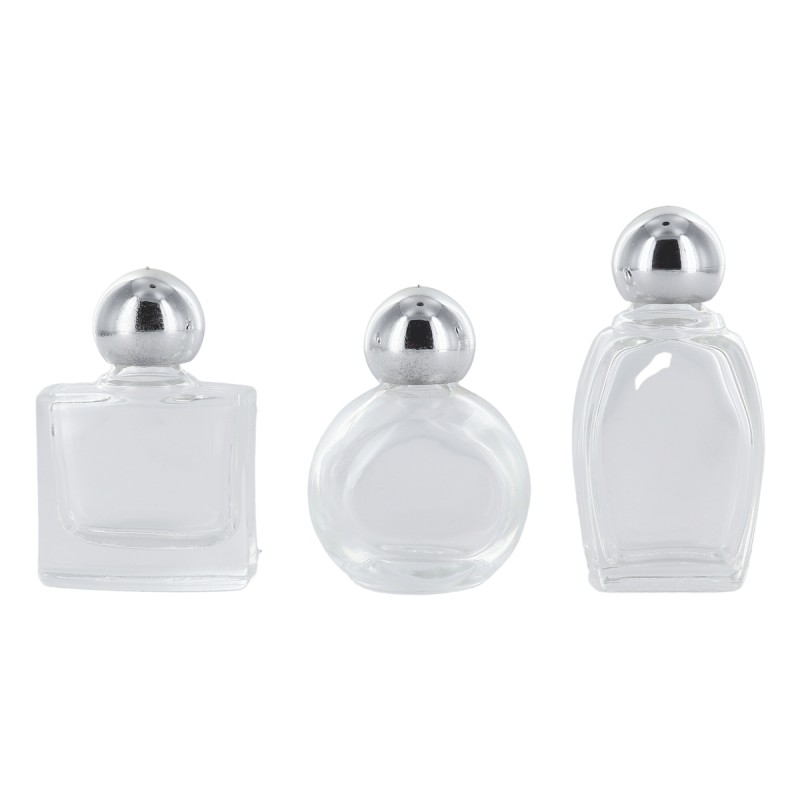 Bouteilles en verre de differentes formes H. 4,5 cm livrees en assortiment.