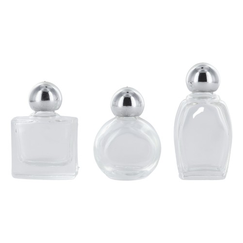 Bouteilles en verre de differentes formes H. 4,5 cm livrees en assortiment.