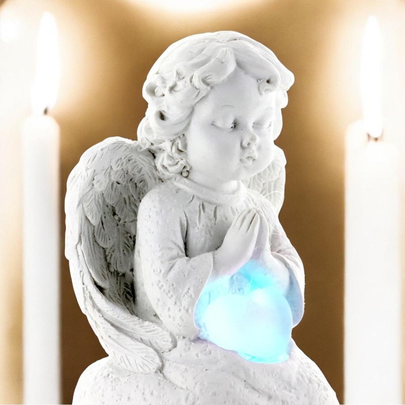 Ange assis en pière avec un coeur lumière tournante- Hauteur 9 cm
