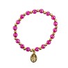 Bracelet sur élastique couleur dorée grains à facettes couleurs assorties Ø 6 mm, avec médaille de la Vierge Miraculeuse.