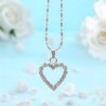 Collier avec chaine couleur argentee L. 45 cm, coeur en zirconium couleur assortie H. 1,5 cm.