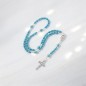 Chapelet avec grains en turquoise synthétique Ø 6 mm, croix en métal avec Christ. Longueur jusqu'au cœur 30 cm.
