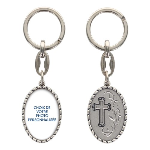 Porte-clés en aluminium de couleur argenté, hauteur 3,8 cm, avec résine. Disponible avec plusieurs saints au choix.