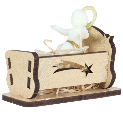 Enfant Jésus bras ouverts H. 4 cm, fluorescent pour crèche avec berceau bois L. 7 cm.