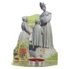Bougeoir en plexi assemblable, avec représentations de saints. Livre avec une bougie, H. 13,5 cm. Plusieurs saints.